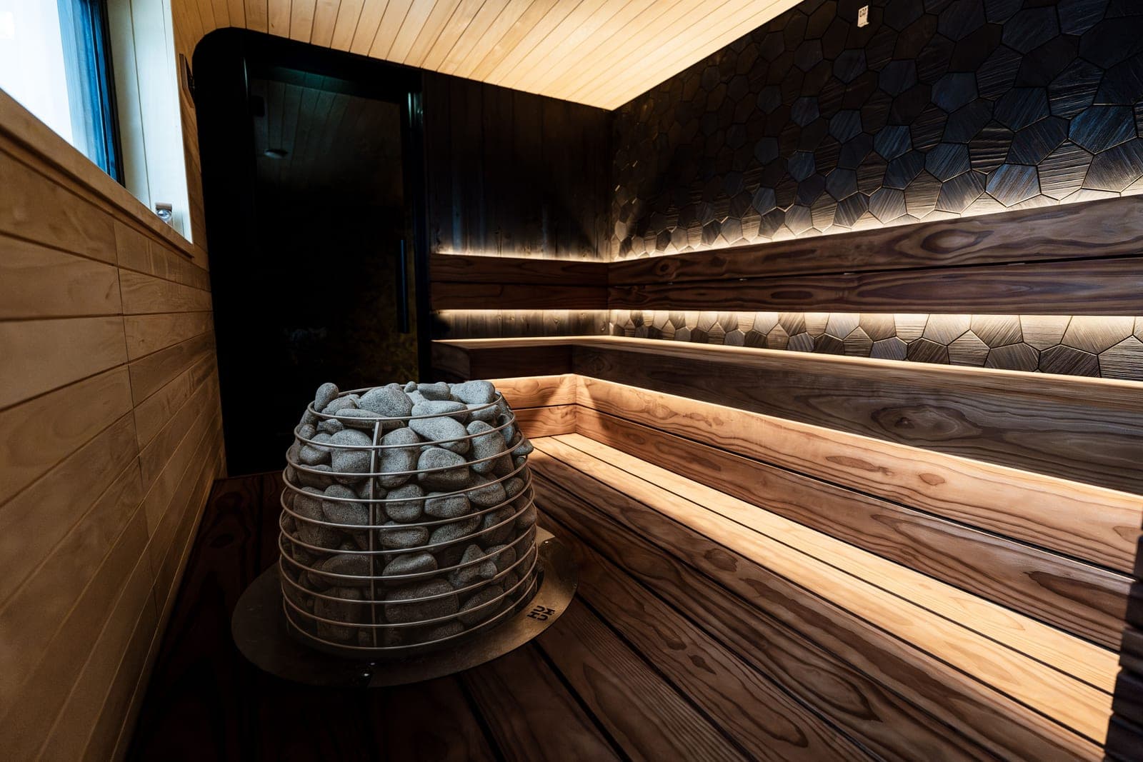 A modern home sauna interior finished in warm cedar